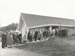 800-service of entry into the current building 1956 - note dirt road